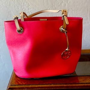 Michael Kohrs red leather handbag